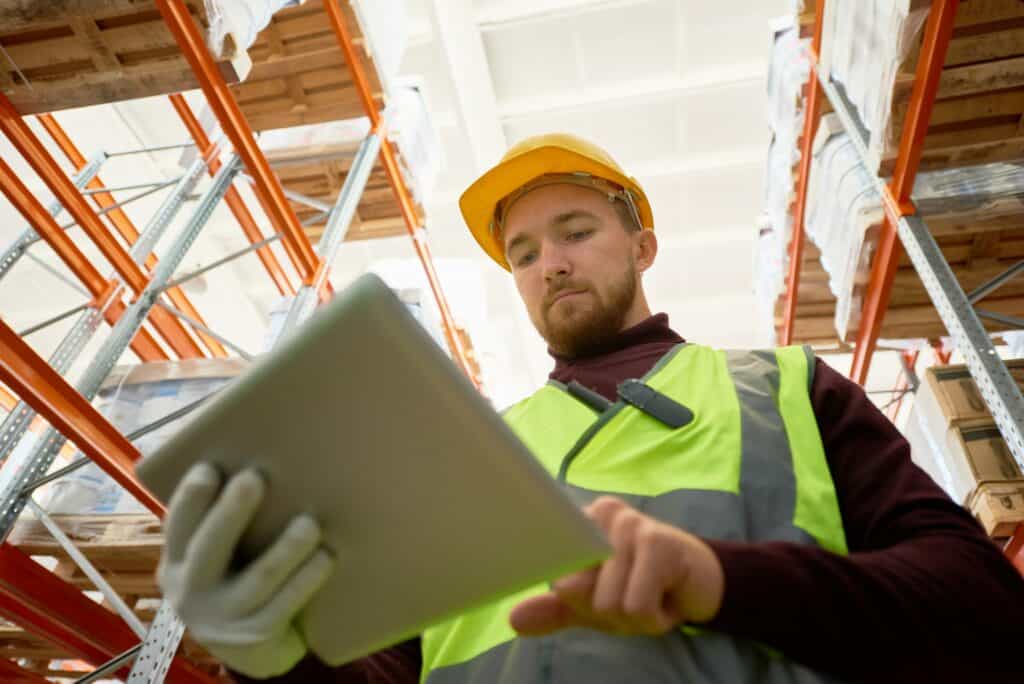 Worker Doing Inventory in Warehouse