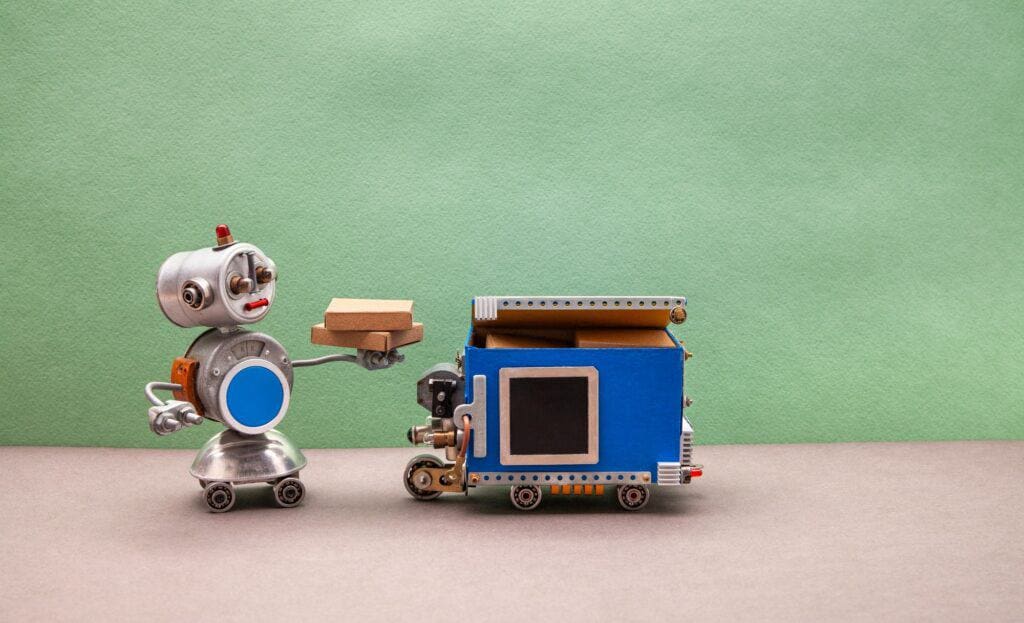 Delivery business concept. Robot toy with parcel boxes